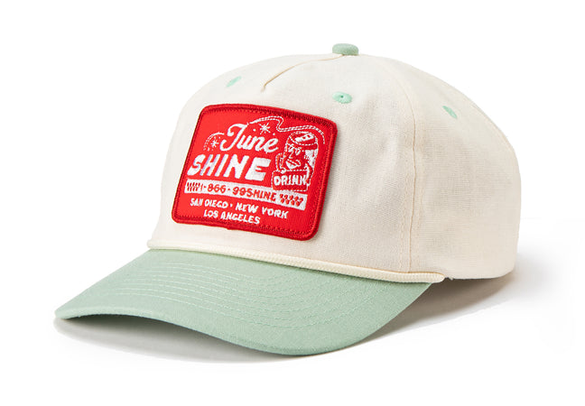 JuneShine baseball cap with turquoise brim, white body and red patch