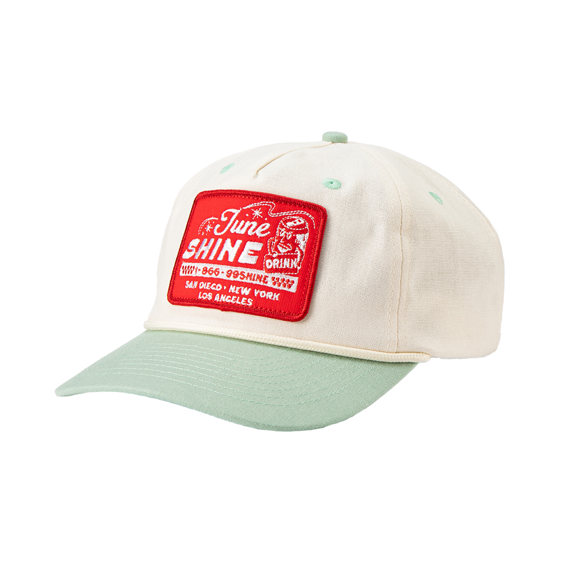 Cream colored hat with turquoise brim and red patch that reads JuneShine, 1-866-99SHINE San Diego, New York, Los Angeles
