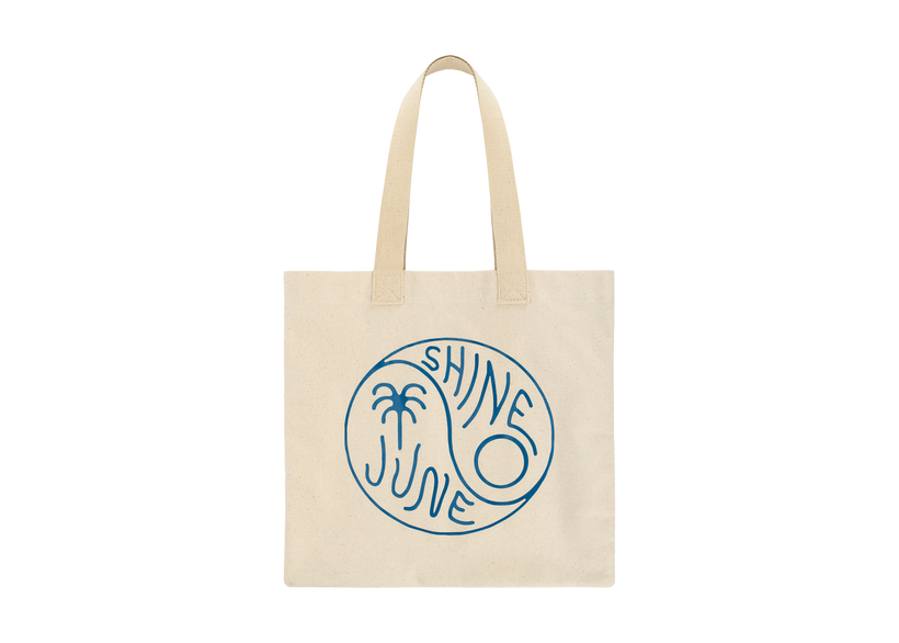 Cream color tote bag with blue ying yang symbol that reads; June Shine