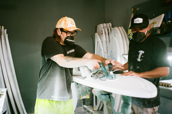 Cody Ko shaping a surfboard