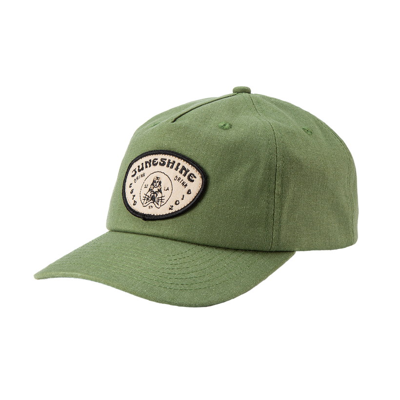 Side view green dad hat with an oval patch that reads; 