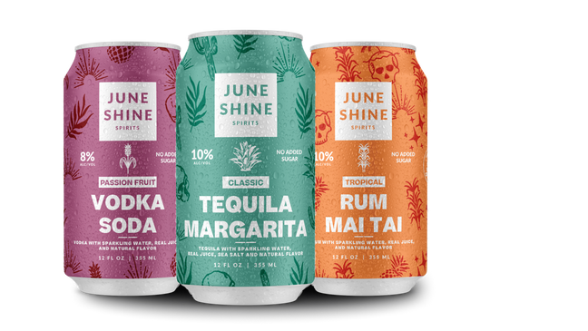 Cans of JuneShine Spirits left to right - Passion fruit vodka soda, classic tequila margarita, rum mai tai.