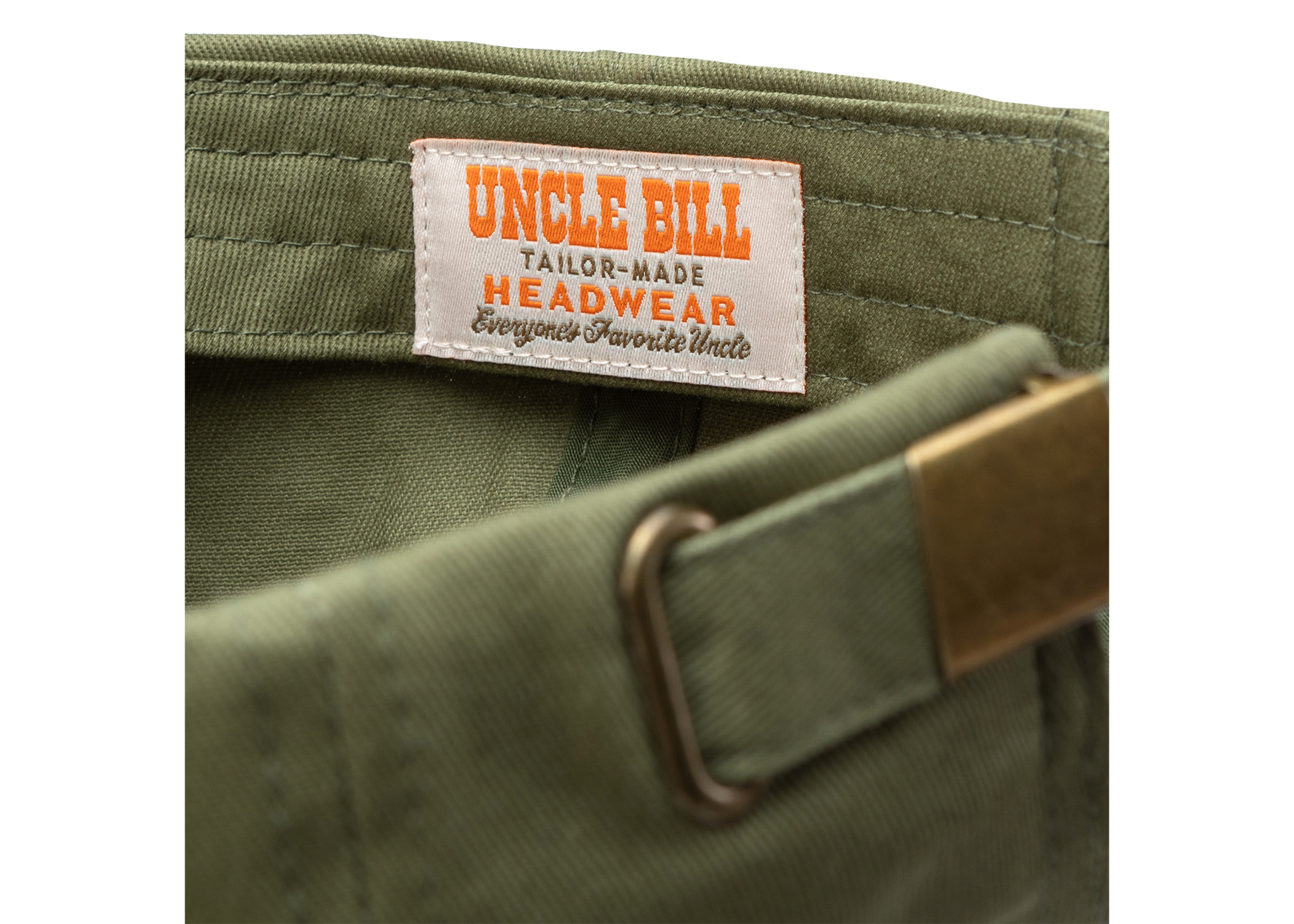 Inside close up view of sewn in tag that reads: "uncle bill tailor-made headwear everyone's favorite Uncle"