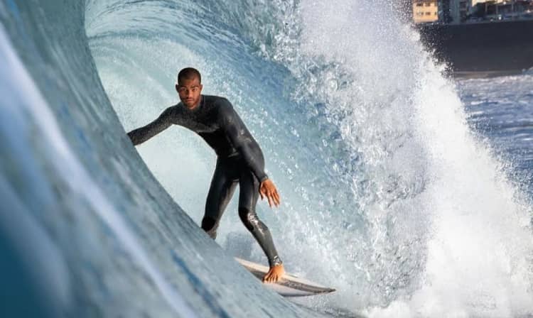 A surfer in a wave barrel